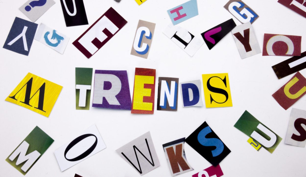 A word writing text showing concept of TRENDS made of different magazine newspaper letter for Business case on the white background with space