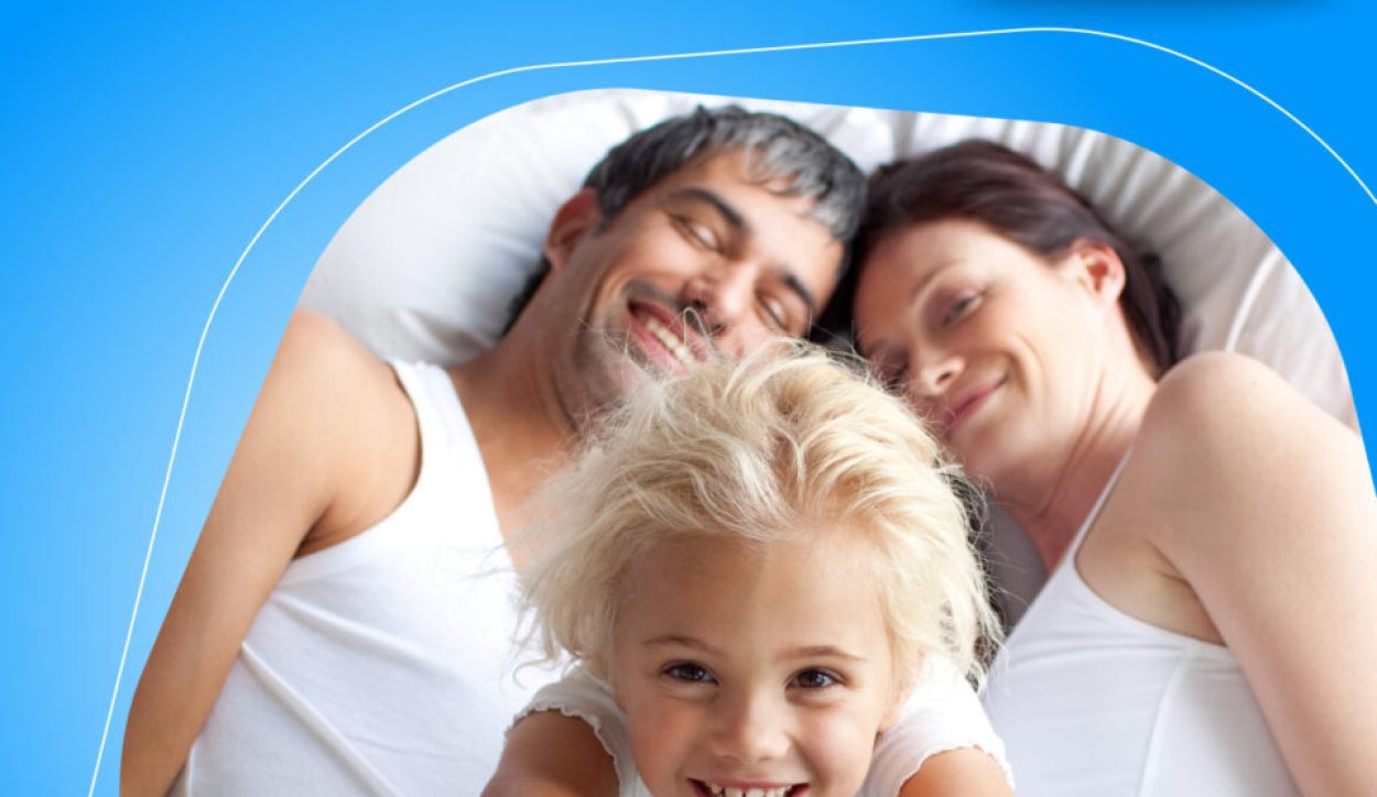 Happy,Little,Girl,On,Bed,With,Thumbs,Up,Smiling,At